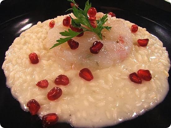 Risotto allo spumante con tartare di scampi e melograno