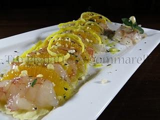Carpaccio di gamberoni e arancia con mandorle, emulsione di cedro e menta