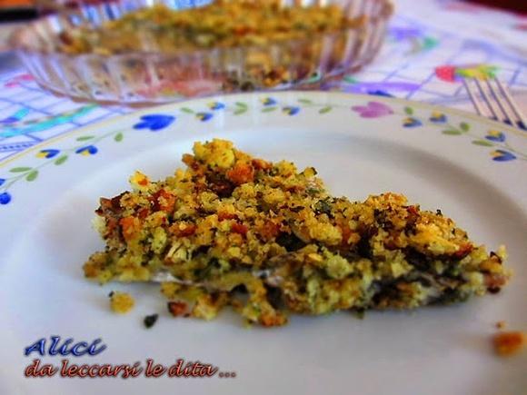 Alici al forno con pane raffermo e prezzemolo