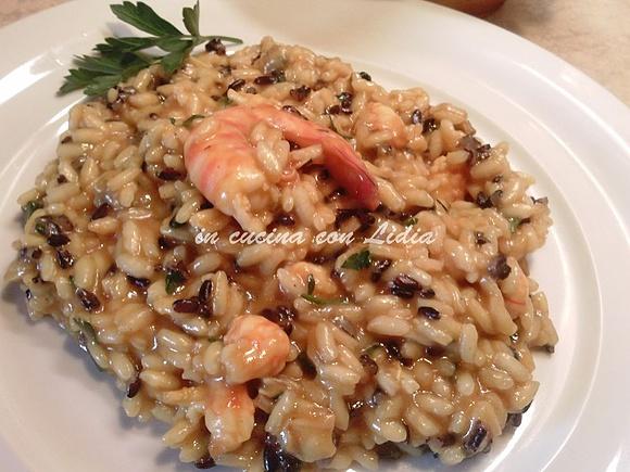 Risotto di mare con mazzancolle, vongole e salsa al curry